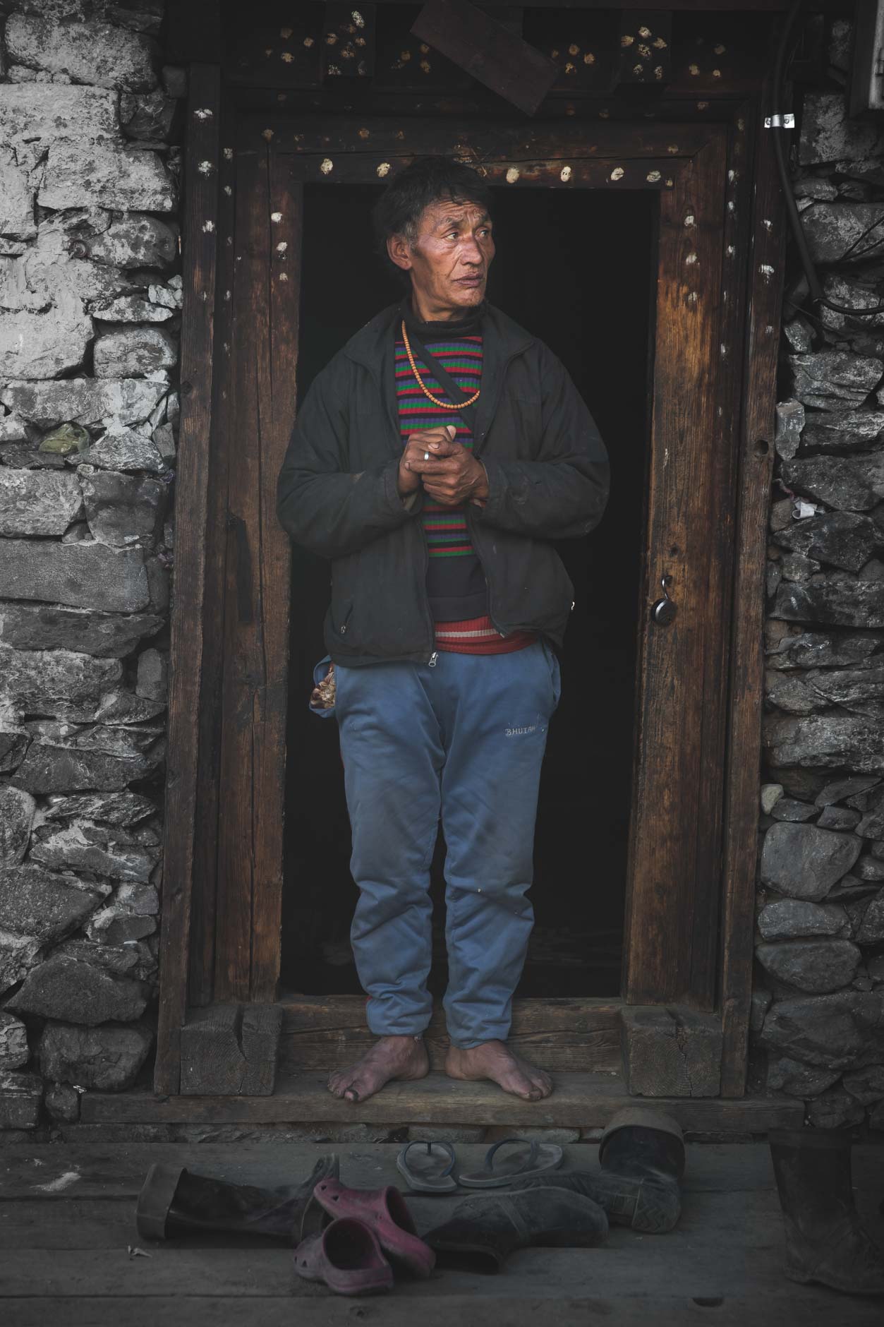 portrait photography of an elderly man in Merak, Bhutan