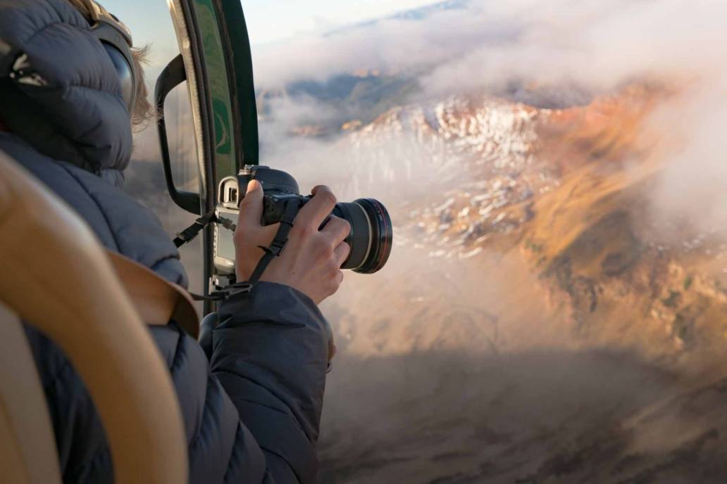 Aerial photography of Toby Harriman in Helicopter flight over Aspen