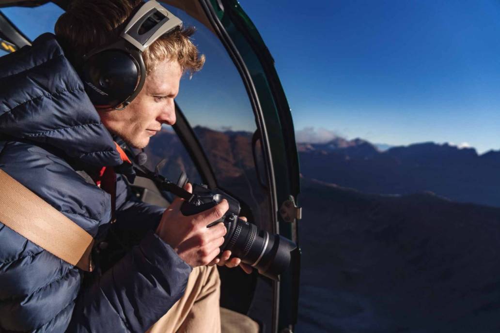 Aerial photography of Toby Harriman in Helicopter flight over Aspen