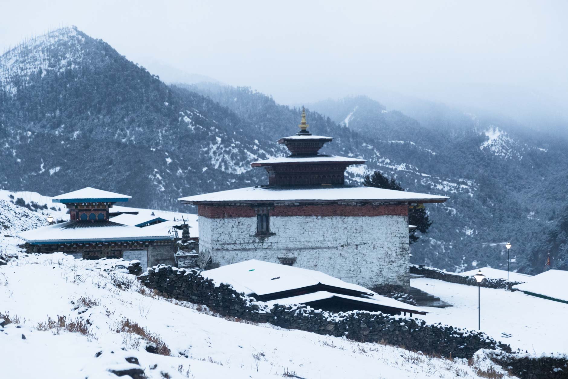 A snowy temple in Merak, Bhutan during winter
