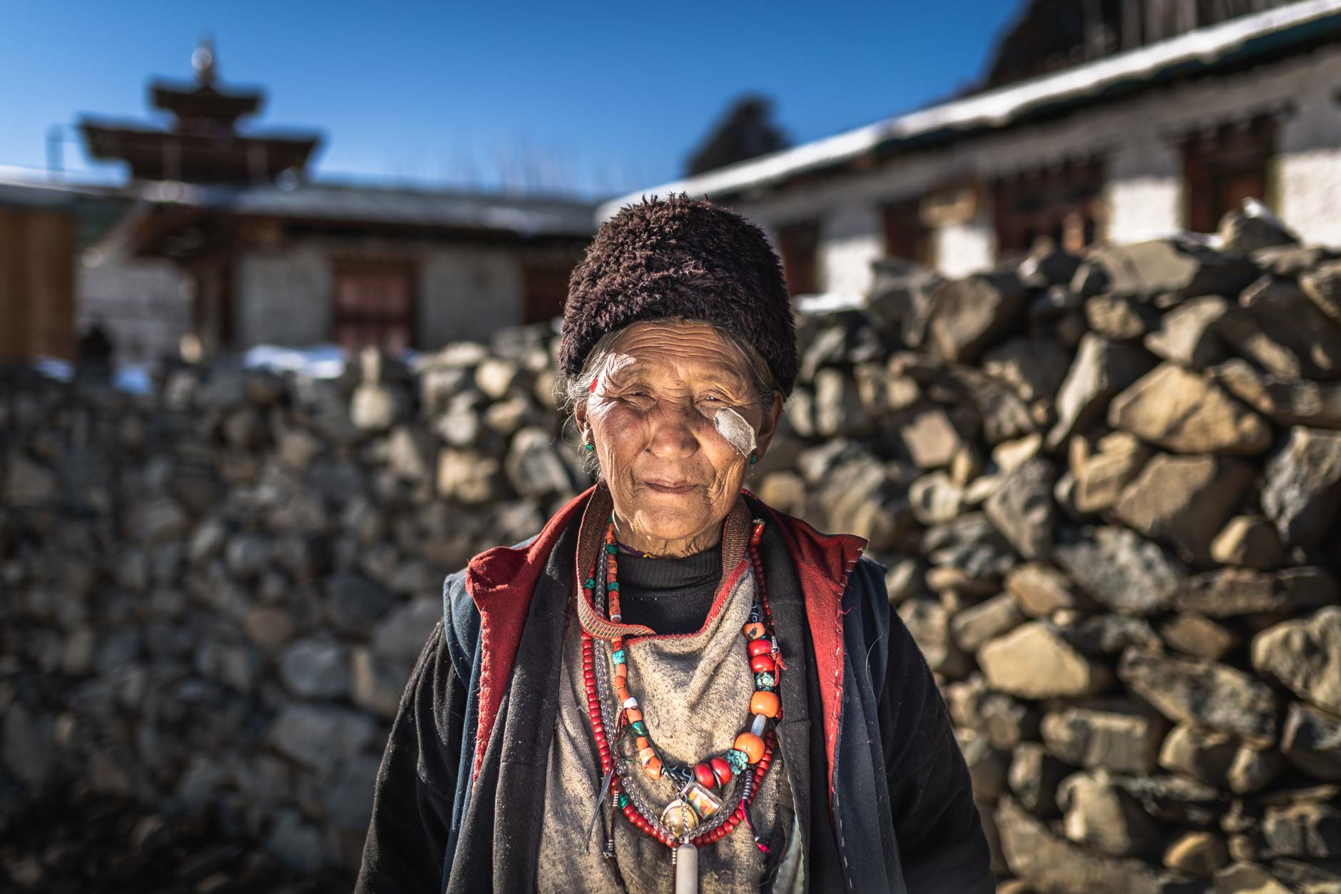 Portrait photography of an elderly tribeswoman in the village of Merak, Bhutan