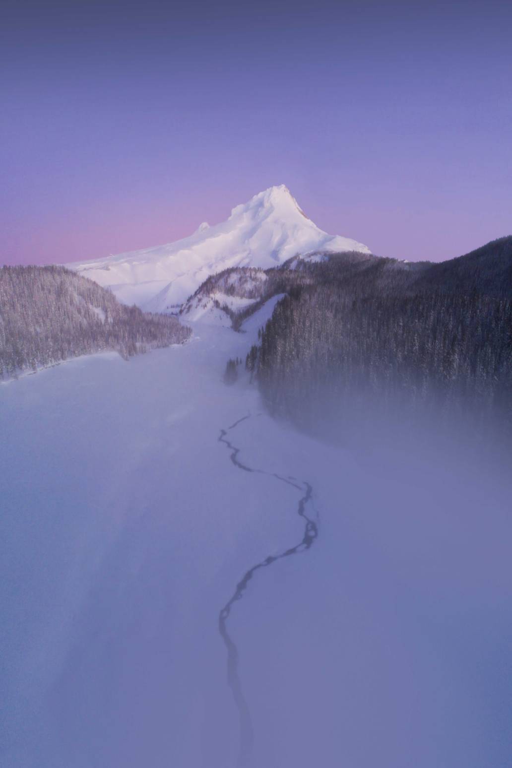 Aerial photography of Mount Hood taken from a snowy White River, Oregon