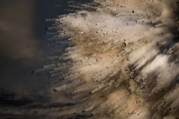 Photography of a drone flying next to a explosions at a lava fire hose in Hawaii Volcanoes National Park