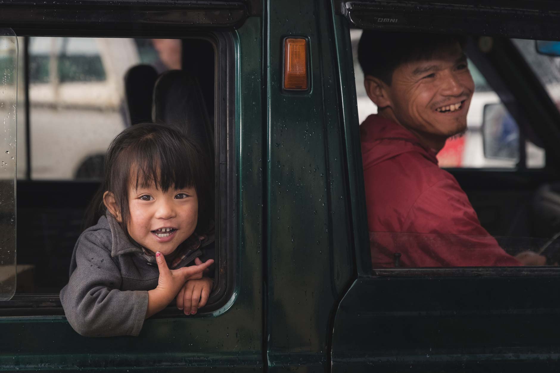Portrait photography of a little girl in car in Paro, Bhutan