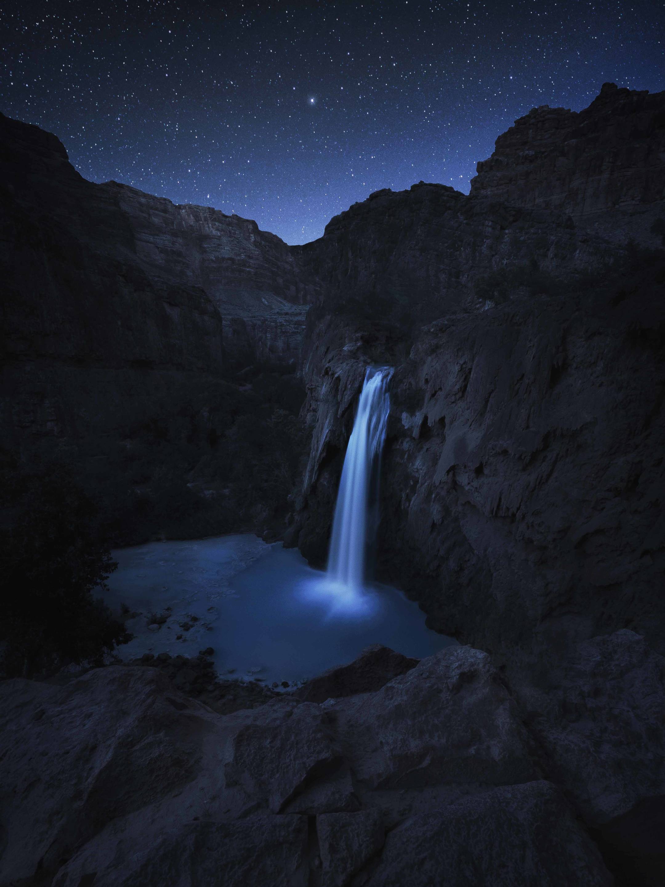 Night photography of the stars over Havasu Falls in Arizona