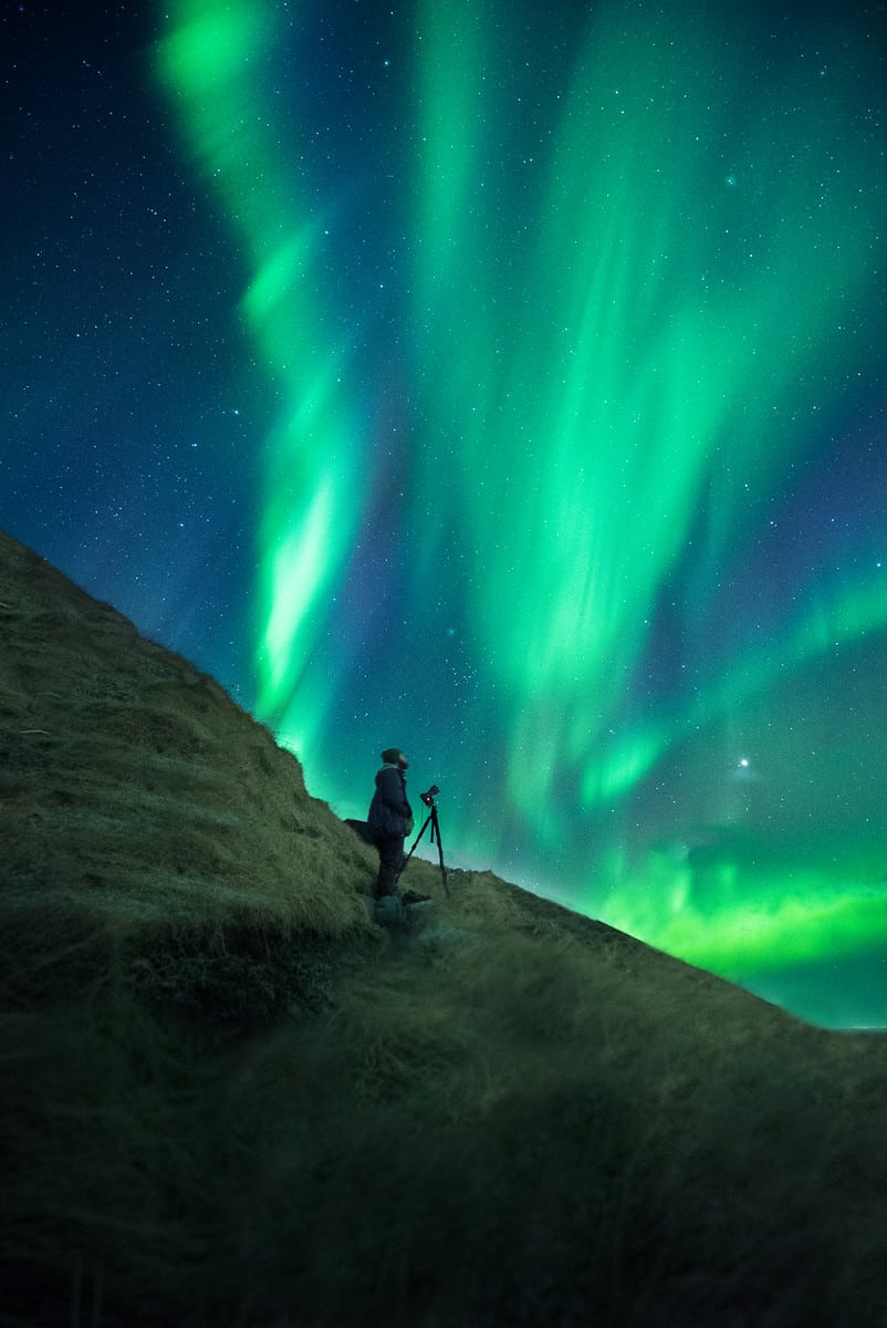 Photographer Michael Shainblum photographs the northern lights in Iceland