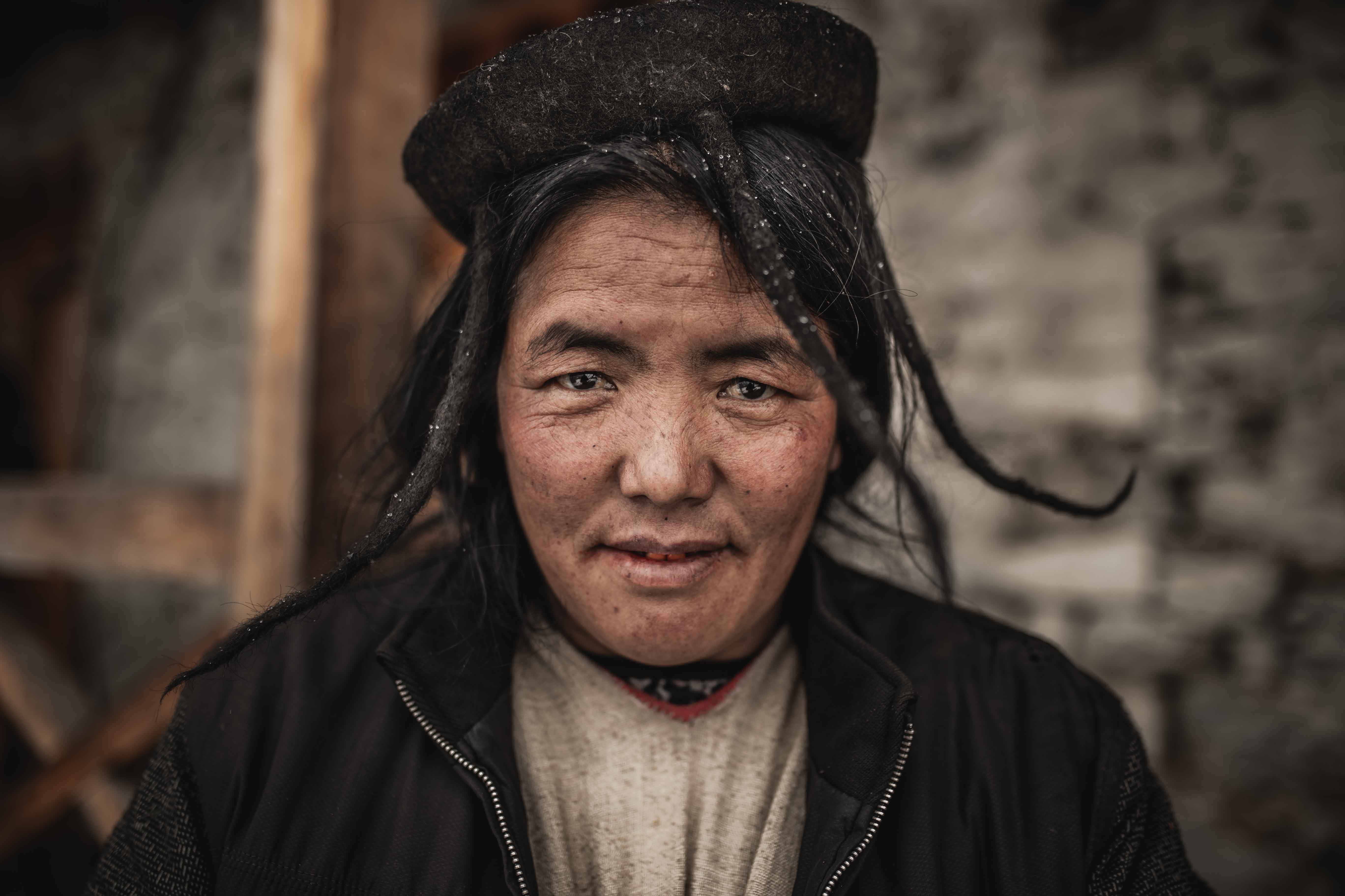 Elderly old Brokpa Tribe woman in Merak, Bhutan during the winter. Portrait photography