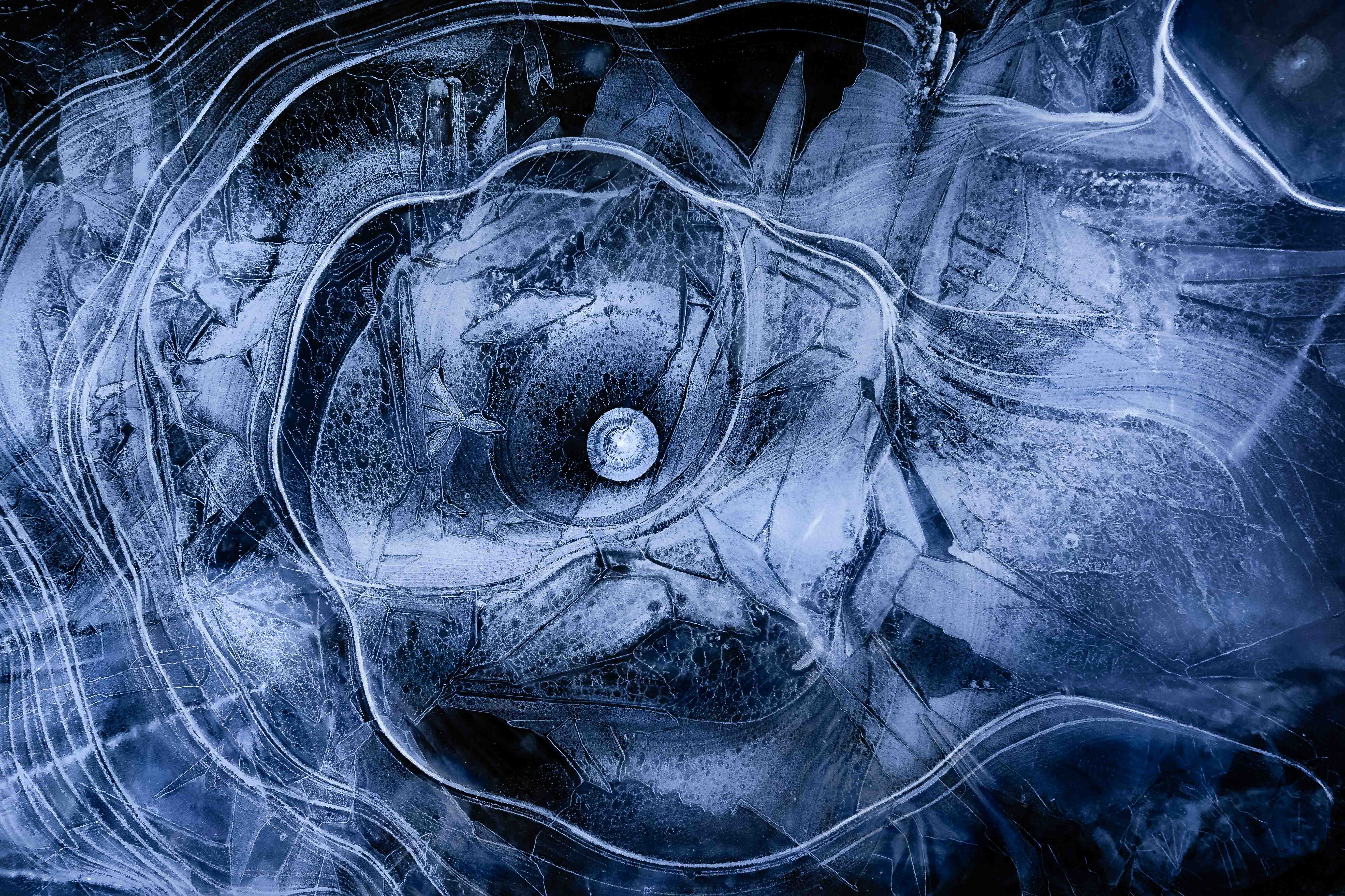 Landscape photography of abstract patterns found in a frozen creek on Mount Rainier in the winter