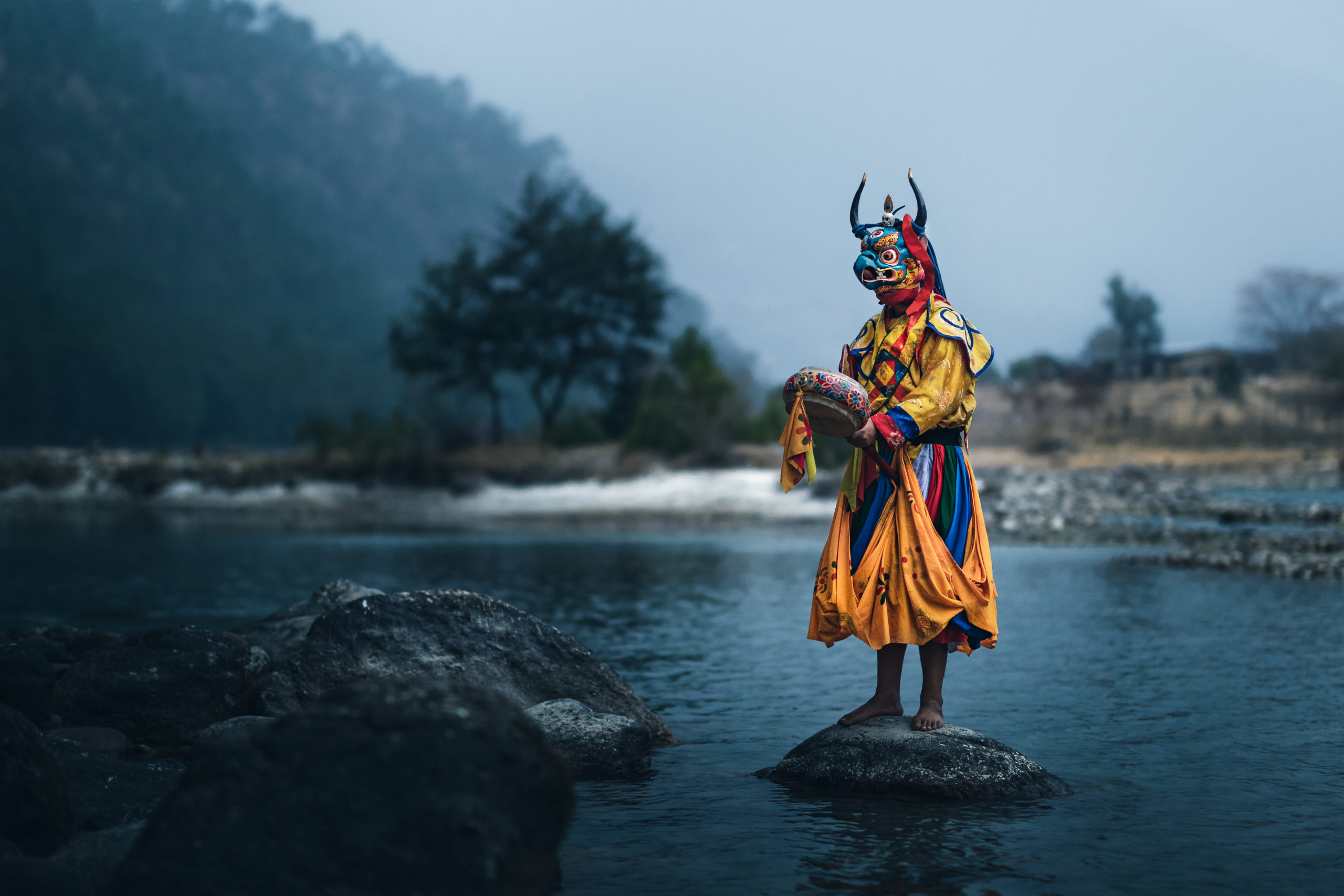 Photography of Bhutan's traditional masked dancers in Punakha