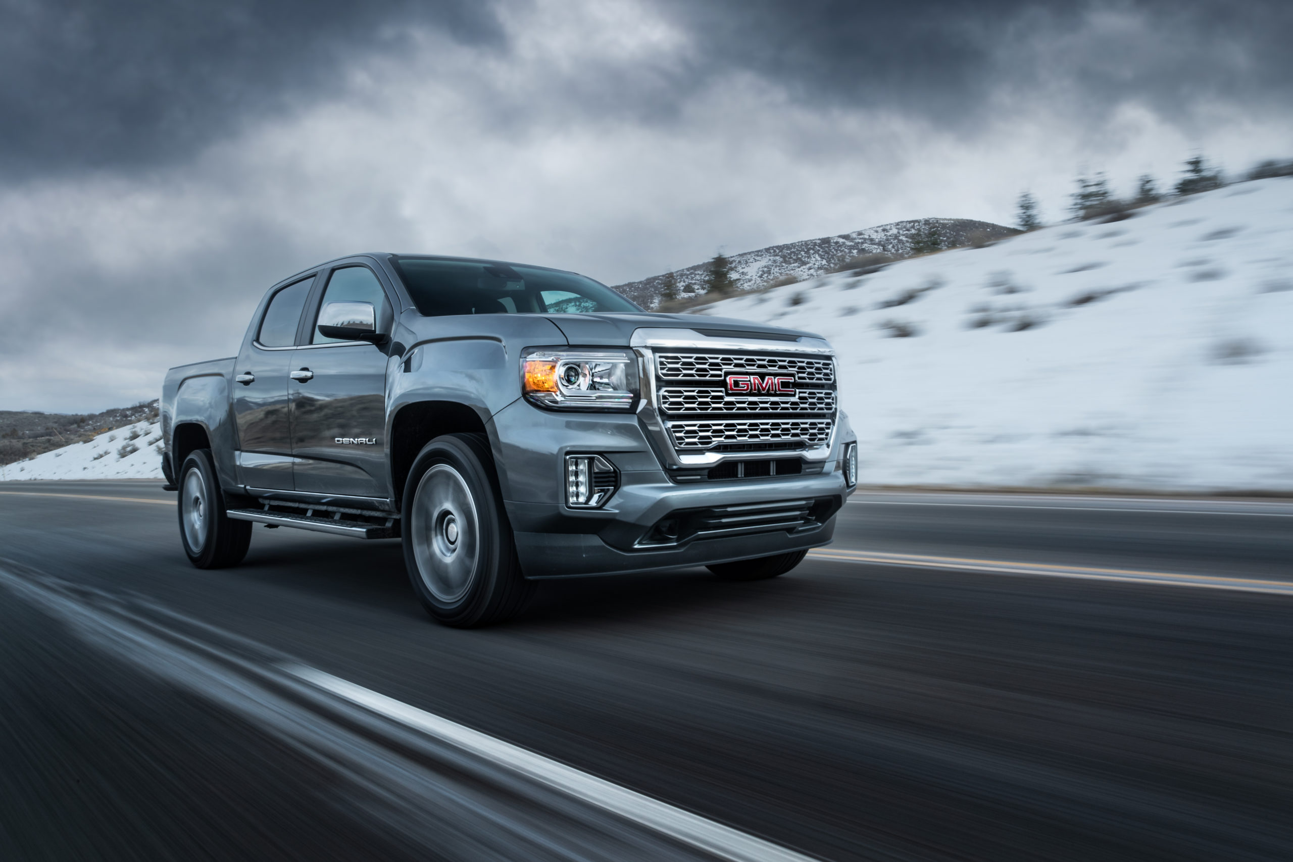 Photography of a GMC silver canyon on a road in Utah during winter by Andrew Studer