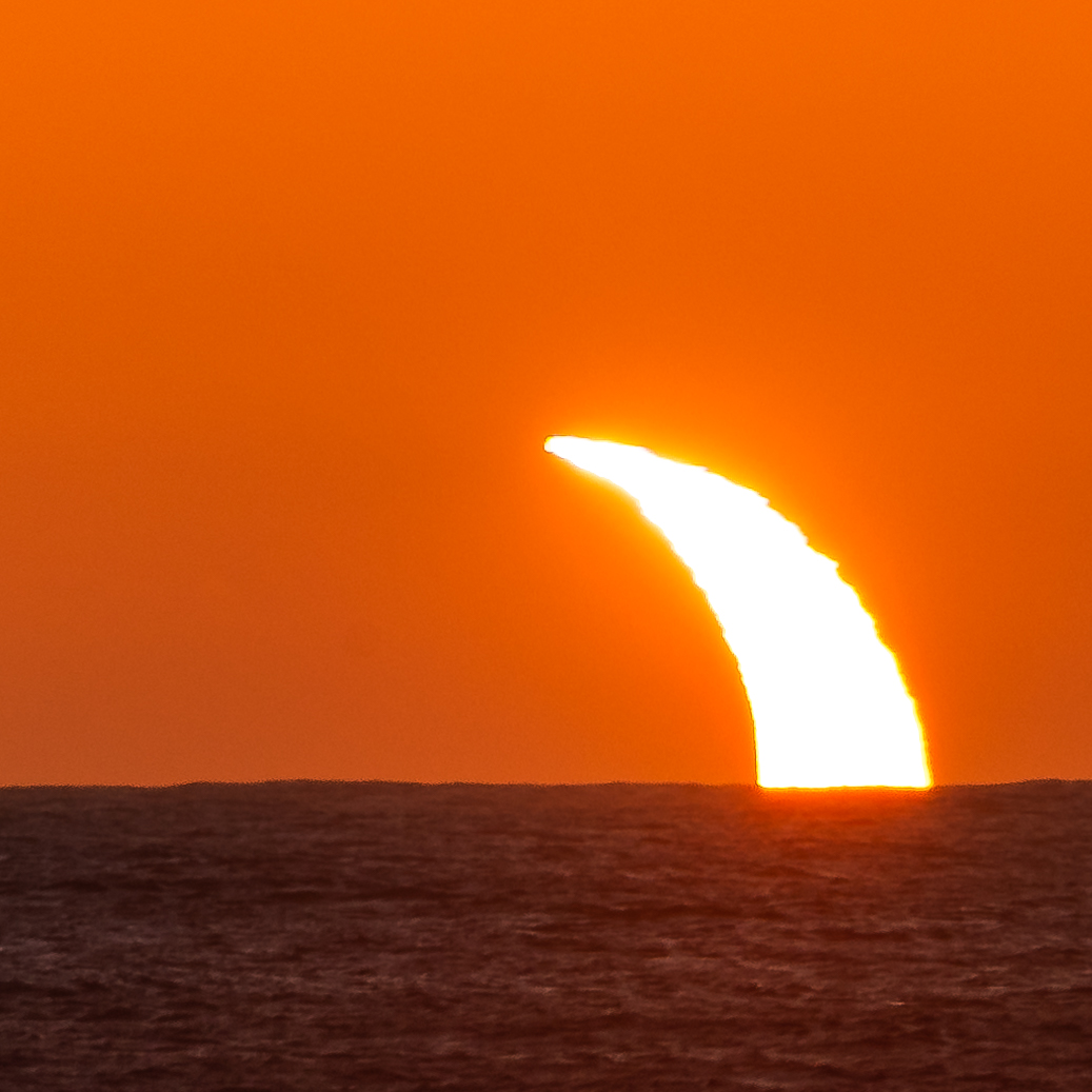 The sun rises over the Antarctic sea eclipsed by the moon on December 4 2021