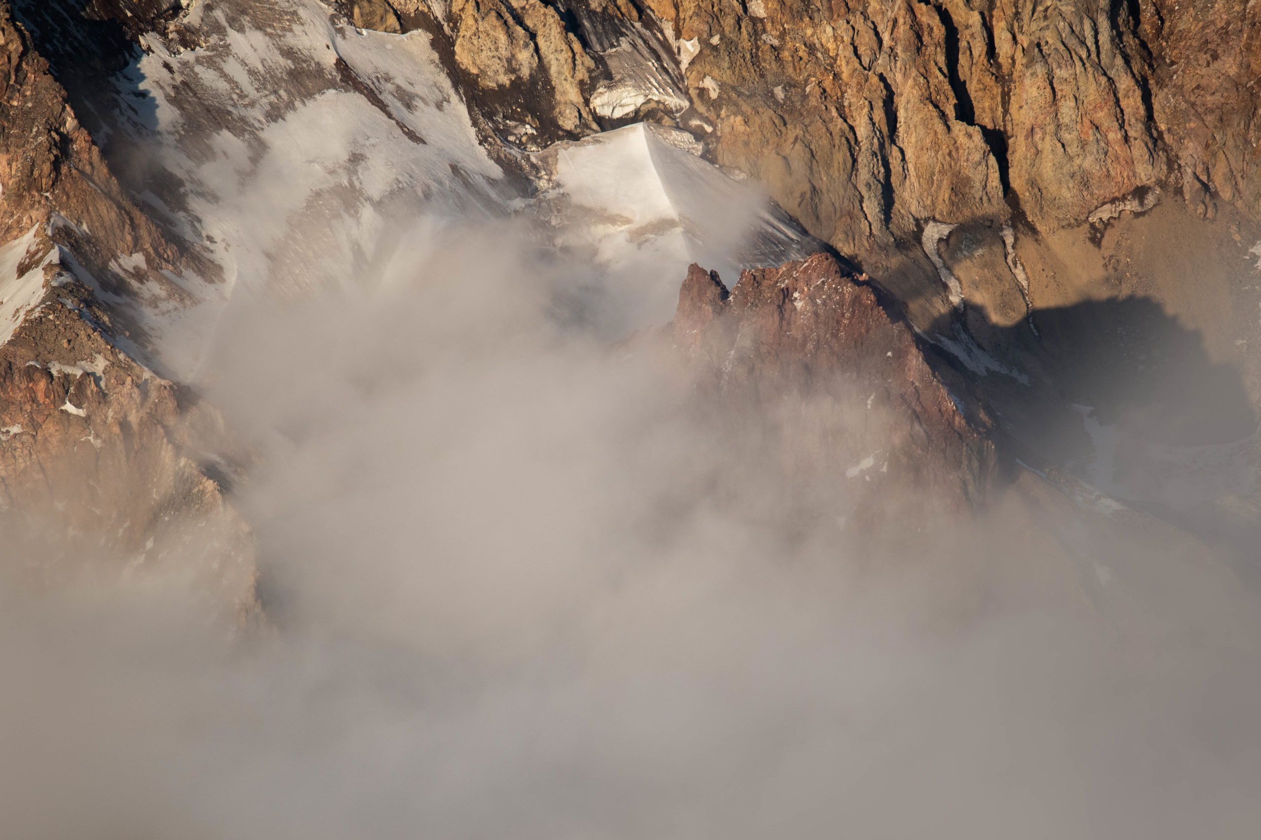 Closeup aerial photography of fog at the base of Mount Hood