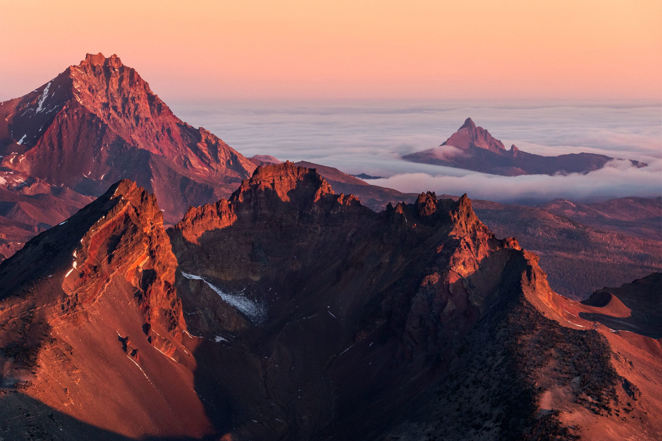 Aerial landscape photography of Broken Top Mountain, North Sister and Mount Washington during sunrise in Central Oregon