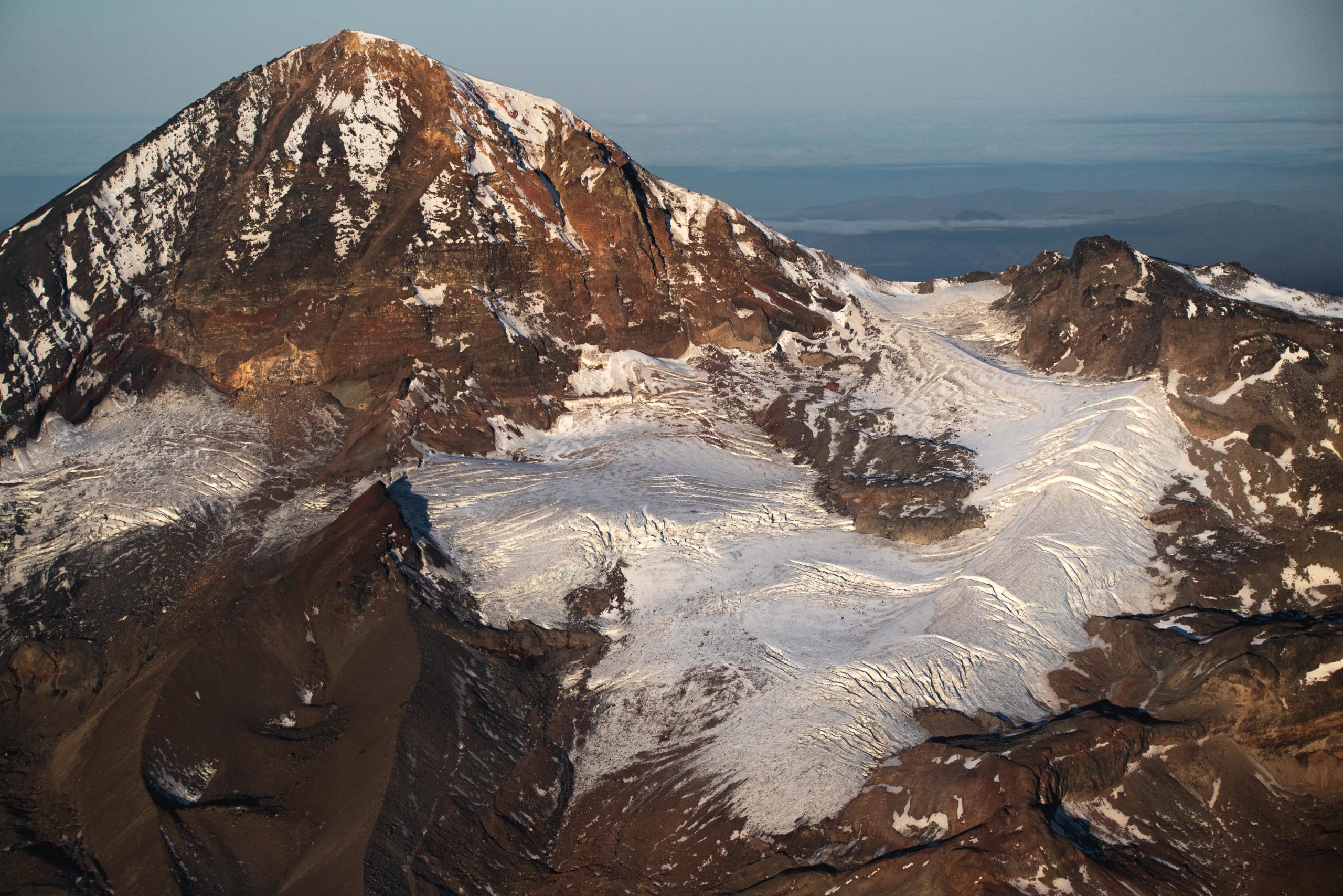Aerial photography of South Sister Mountain's glacier during sunrise in Oregon's cascade mountain range