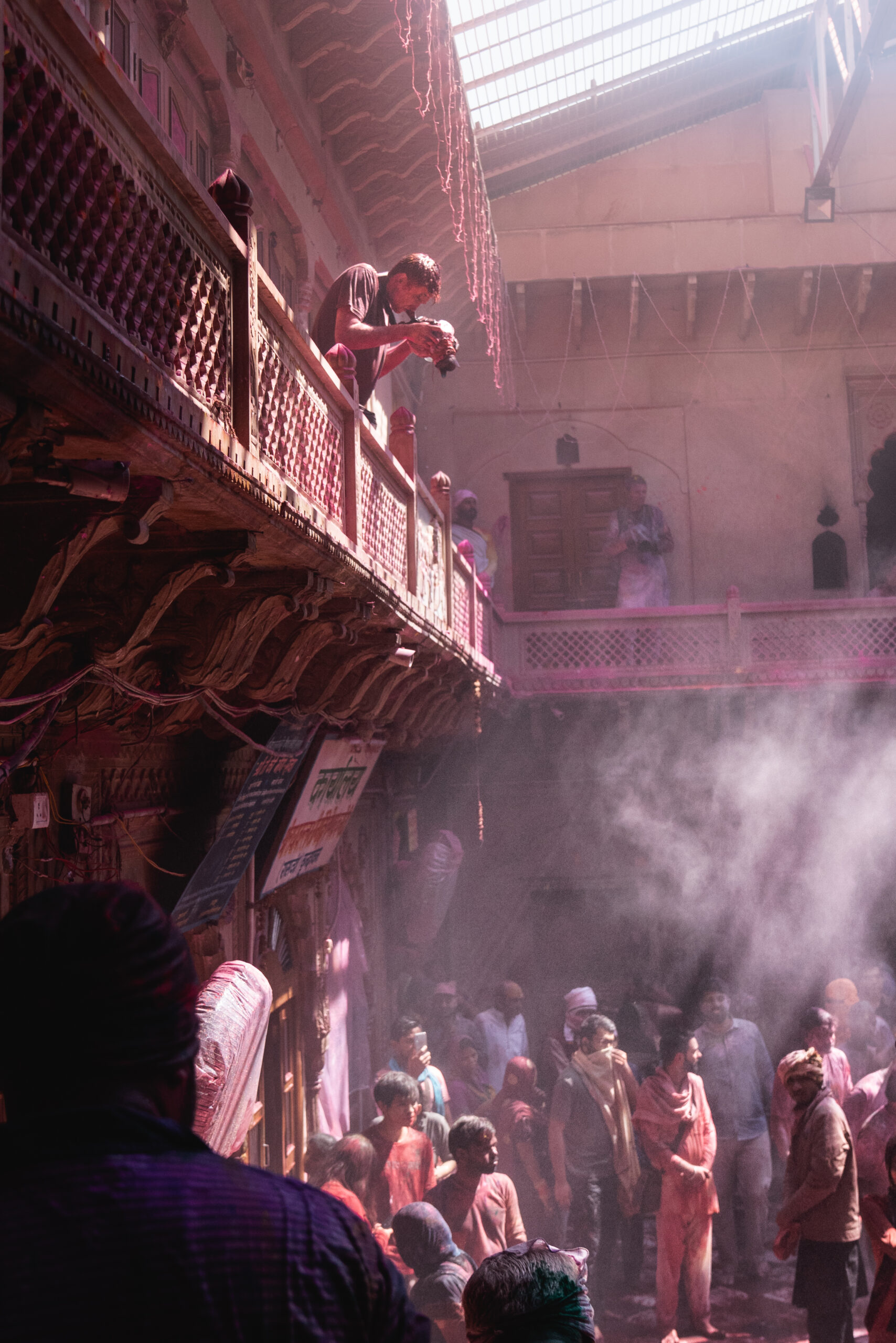 Andrew Studer photographing the Holi Festival from a balcony at a temple in Vrindavan. Photo by Paul V Harrison