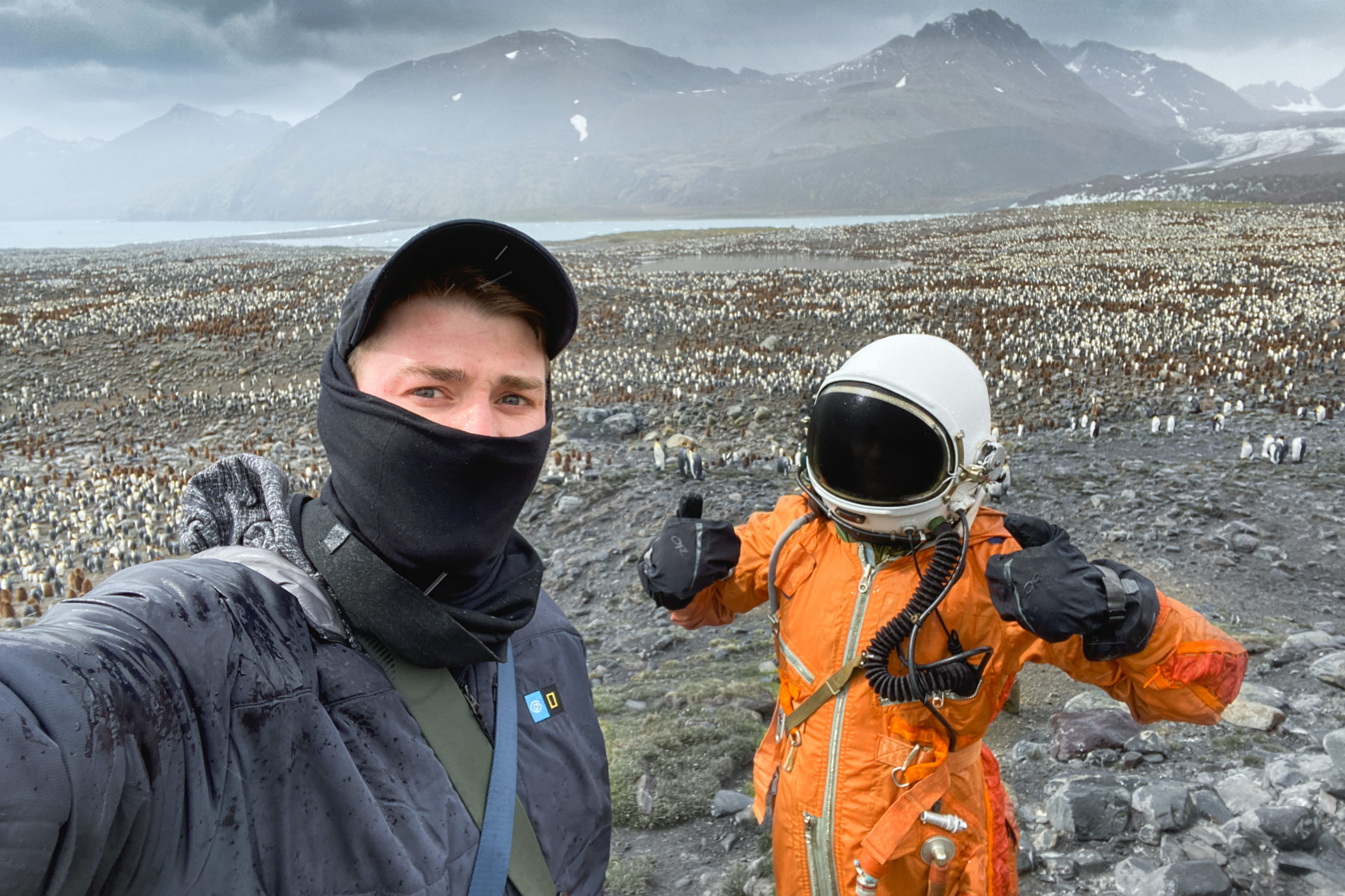 Behind the scenes of photographer Andrew Studer and 'astronaut' Bailey O'Bar working on 'Space to Roam' on South Georgia Island at a large king penguin colony on St Andrew's Bay.