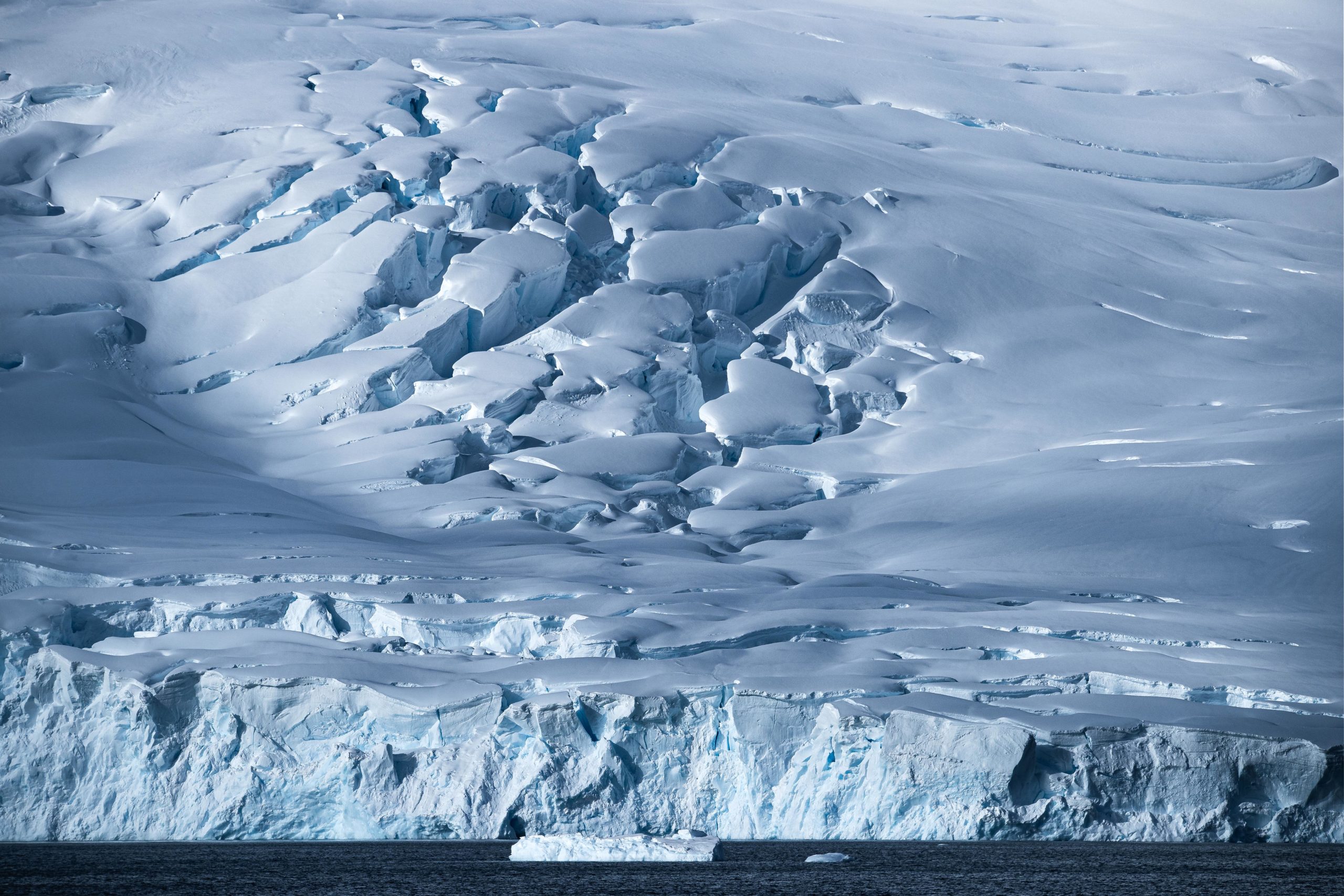 A large glacier meeting the ocean in Antarctica