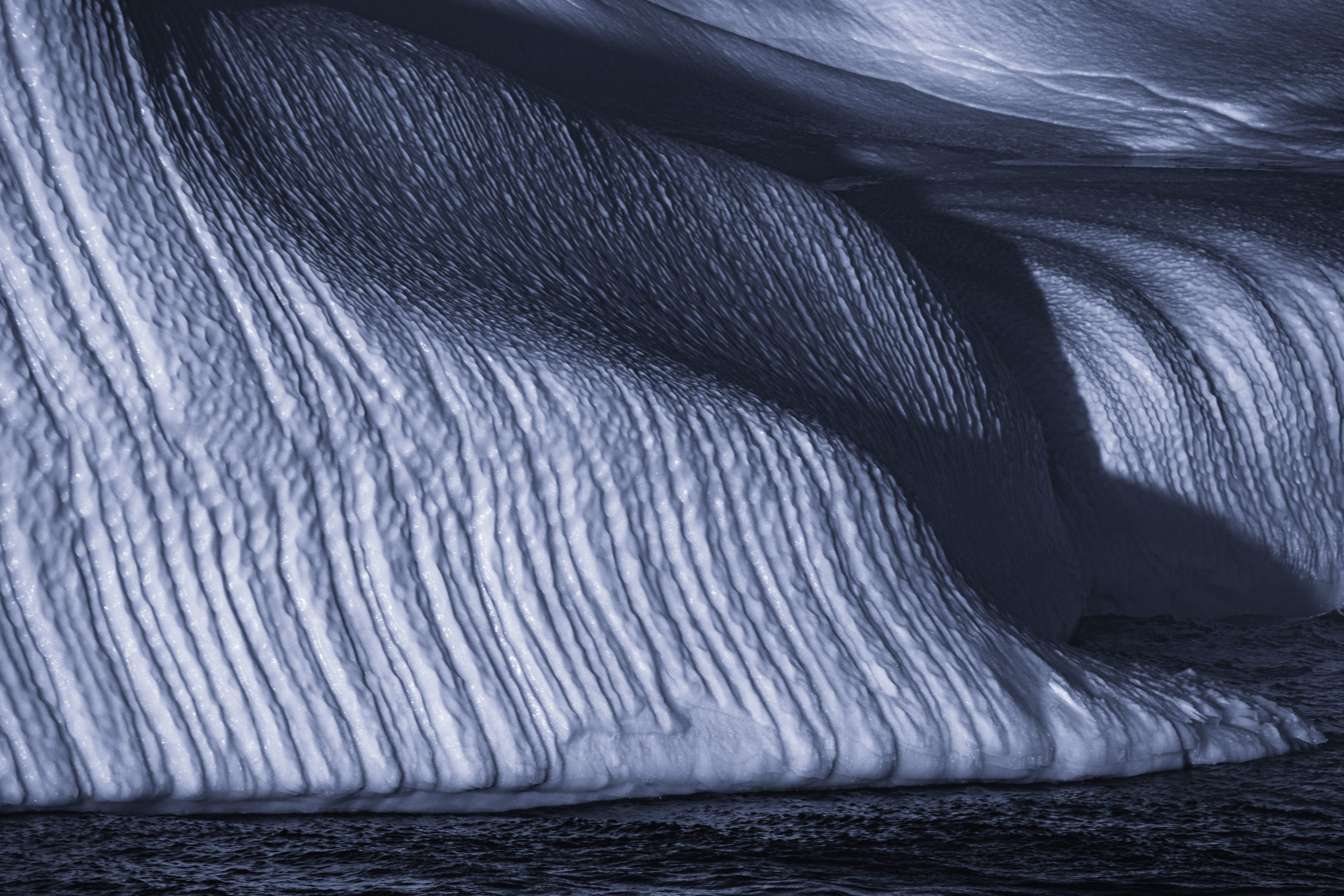 Abstract landscape photography closeup of an iceberg floating in the ocean in the Antarctic Peninsula