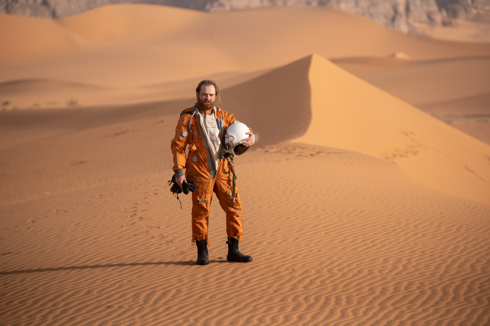 'Astronaut' Niels van de Linde of the Netherlands airs out the space suit in-between shooting in the heat of the Algerian Sahara